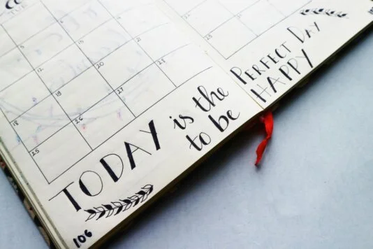 Calendar Calendar that says "Today is the perfect day to be happy".
